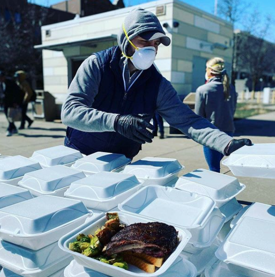 Volunteers hand out meals at Dandelion Pop-Up