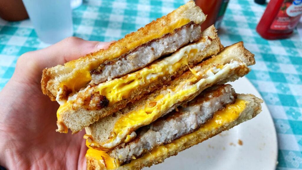 Lisa's Radial Cafe Radial Breakfast Sandwich (in hand)