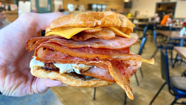 Nite Hawkes Cafe Egg & Cheese Croissant (in hand)