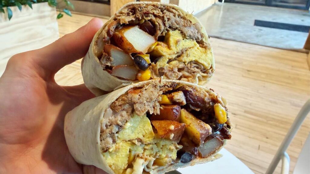 All In Thyme Loaded Carnitas Burrito (in hand)