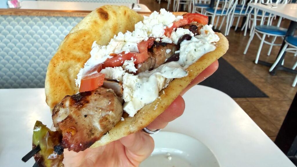 Jim & Jennie's Greek Village Souvlaki Sandwich (in hand)