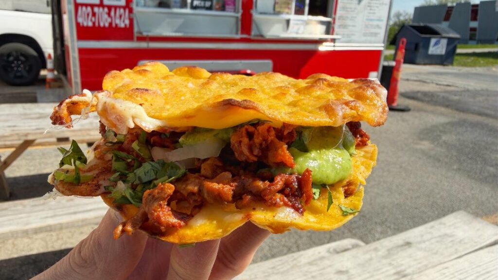 Ma' Mona Al Pastor Vampiro Taco (in hand)