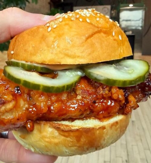 All In Thyme Hot Honey Buffalo Chicken Sandwich (in hand)